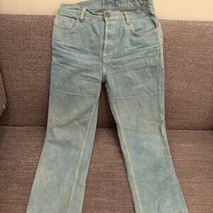 Hand-dyed grey-green denim jeans with rust stictch detailing by Tintoreria Maria